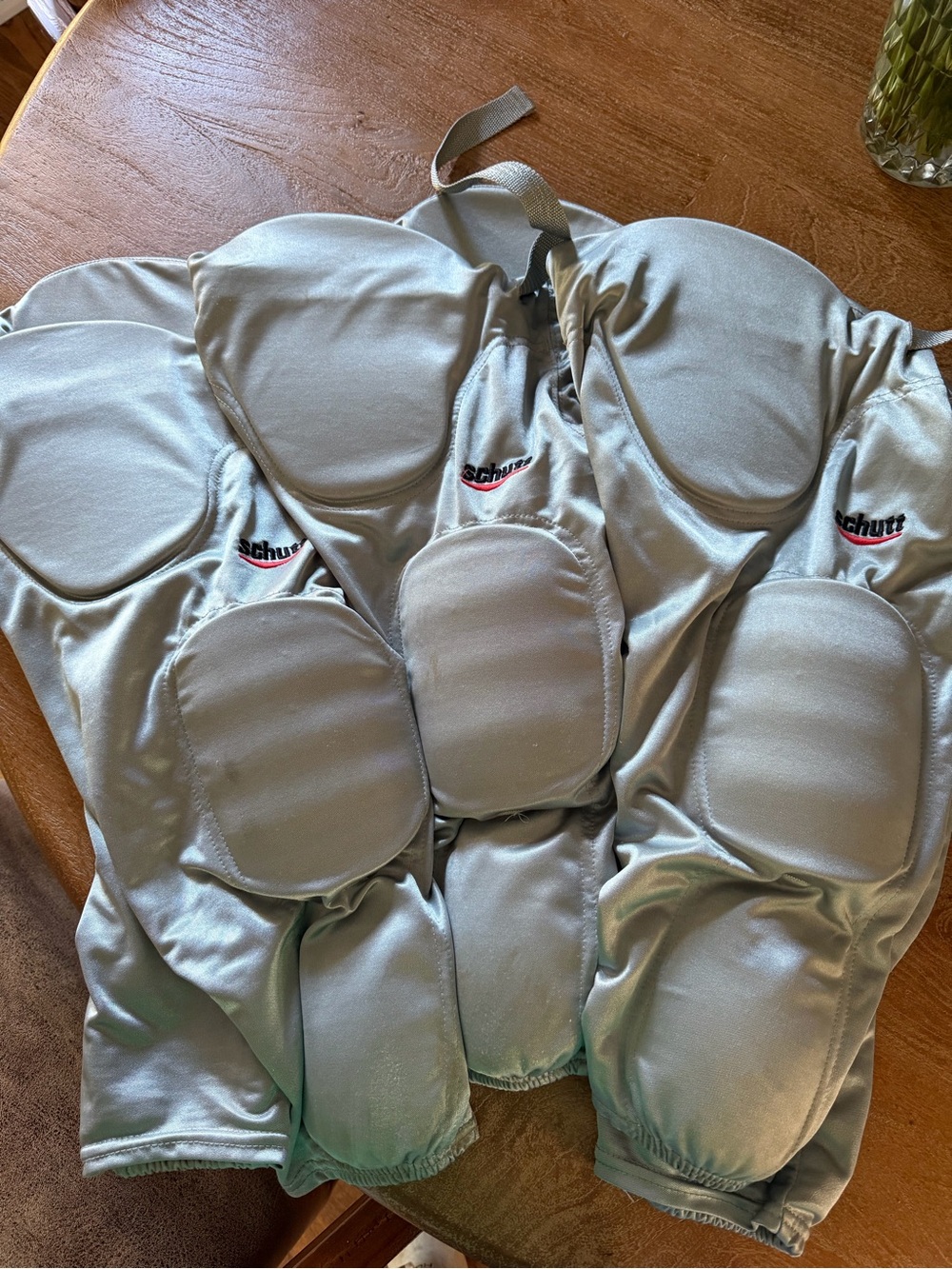 3 pair youth Schutt brand integrated football pants silver